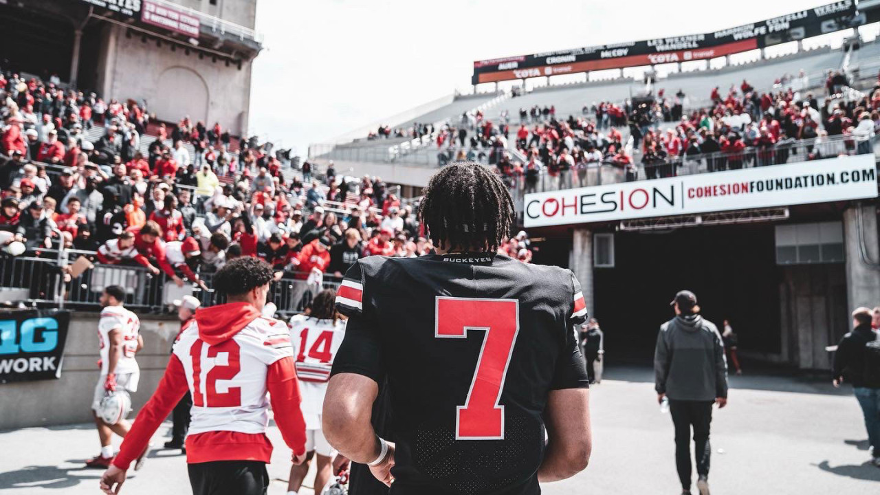 Ohio State Football players walking into tunnel with Cohesion Logo showing